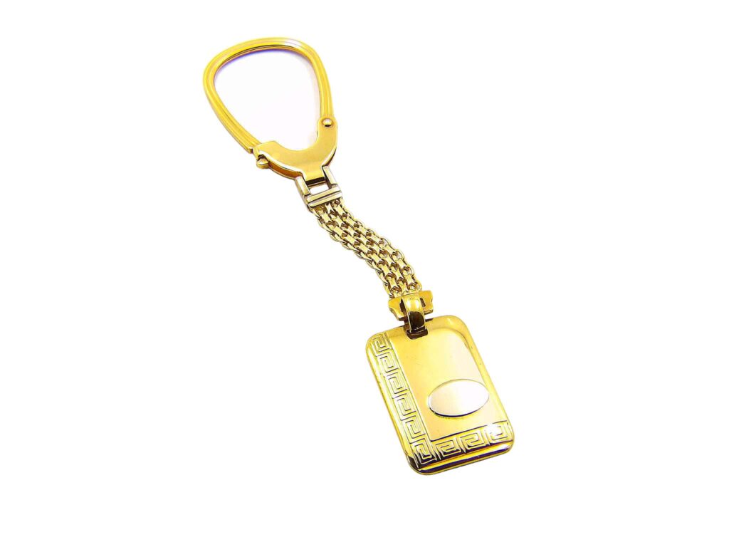 Χρυσό μπρελόκ 18Κ με σχέδιο μαίανδρου και πλεκτή αλυσίδα